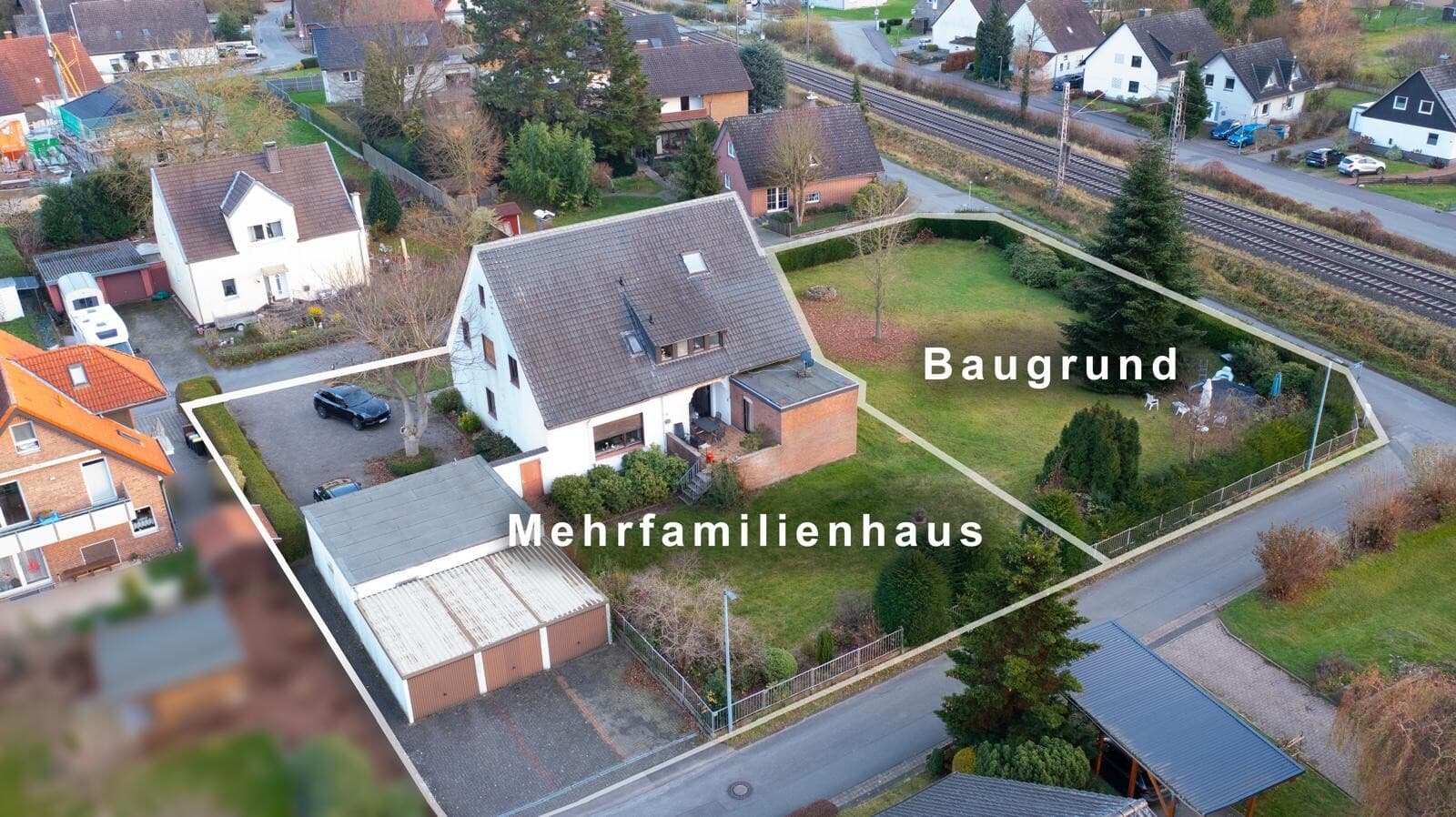 Renditestarkes Mehrfamilienhaus mit 3 Wohneinheiten, 5 Garagen & 1 Baugrundstück in Bünde – Bild 1